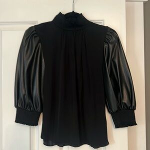 Alice + Olivia silky, mock neck blouse with vegan leather sleeves